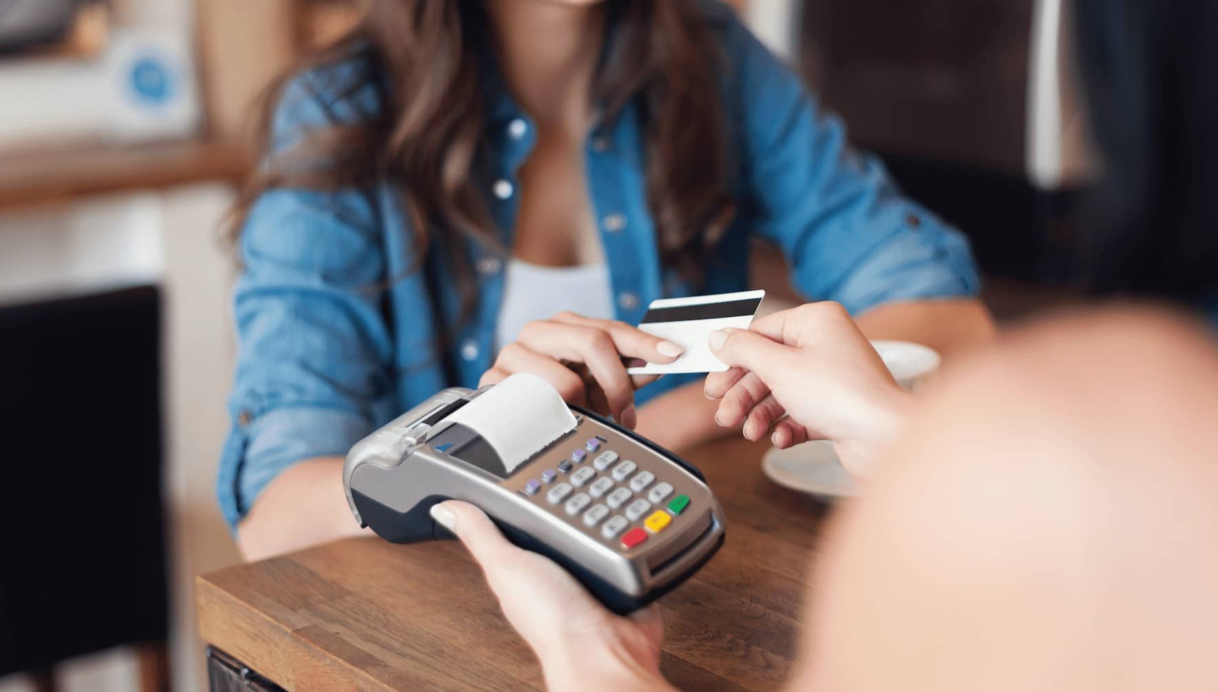 Woman Making In-Person Credit Card Payment